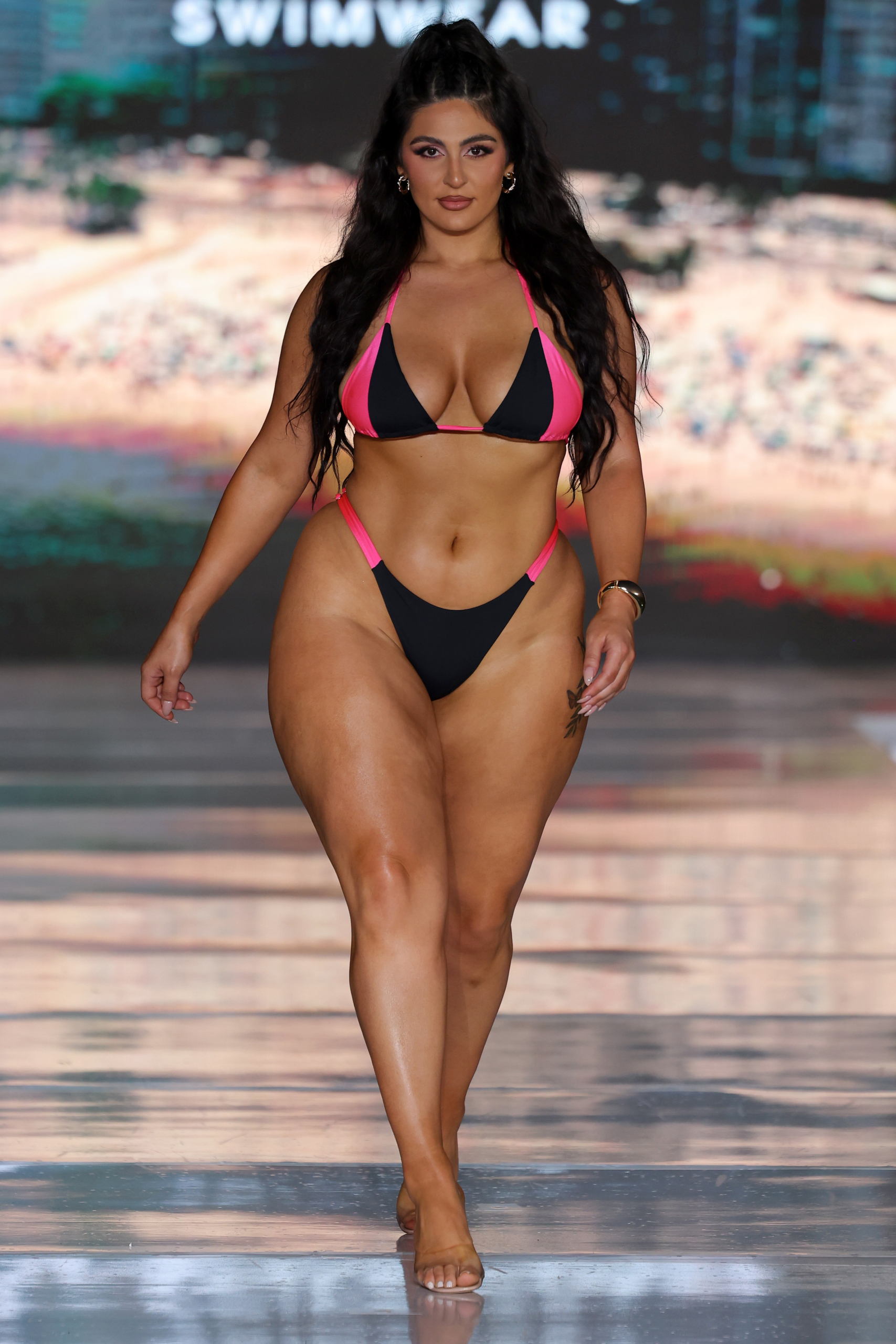 MIAMI BEACH, FLORIDA - JUNE 01: A model walks the runway wearing Malvada Swimwear during Miami Swim Week: The Shows on June 01, 2025 in Miami Beach, Florida. (Photo by Thomas Concordia/Getty Images for Miami Swim Week: The Shows)