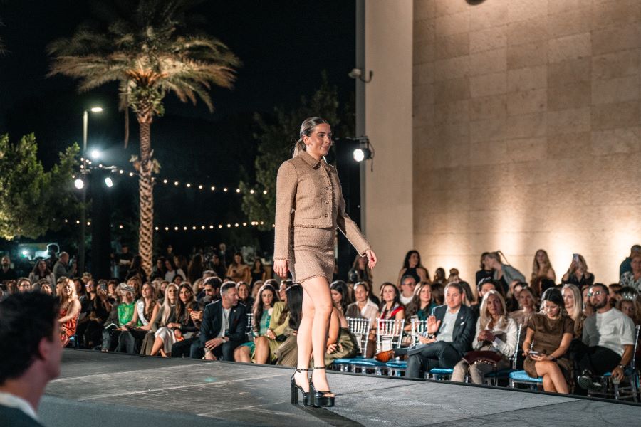 Models wearing Elie Tahari couture at Miami fashion event.