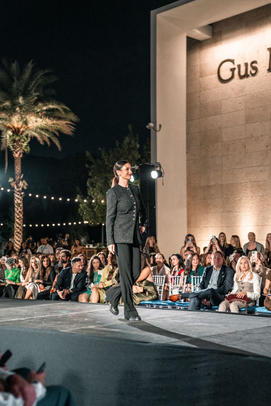 Models wearing Elie Tahari couture at Miami fashion event.