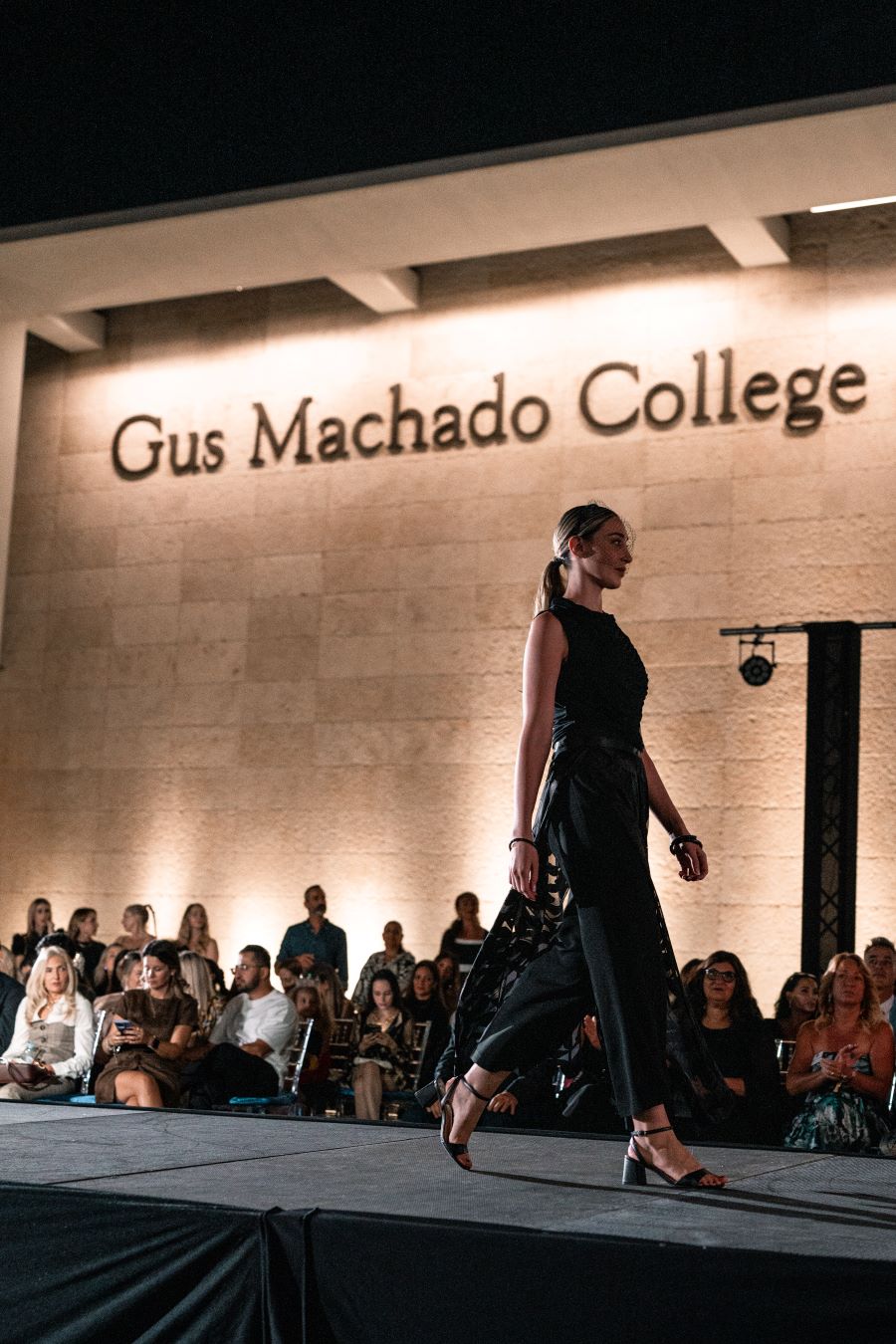 Models wearing Elie Tahari couture at Miami fashion event.