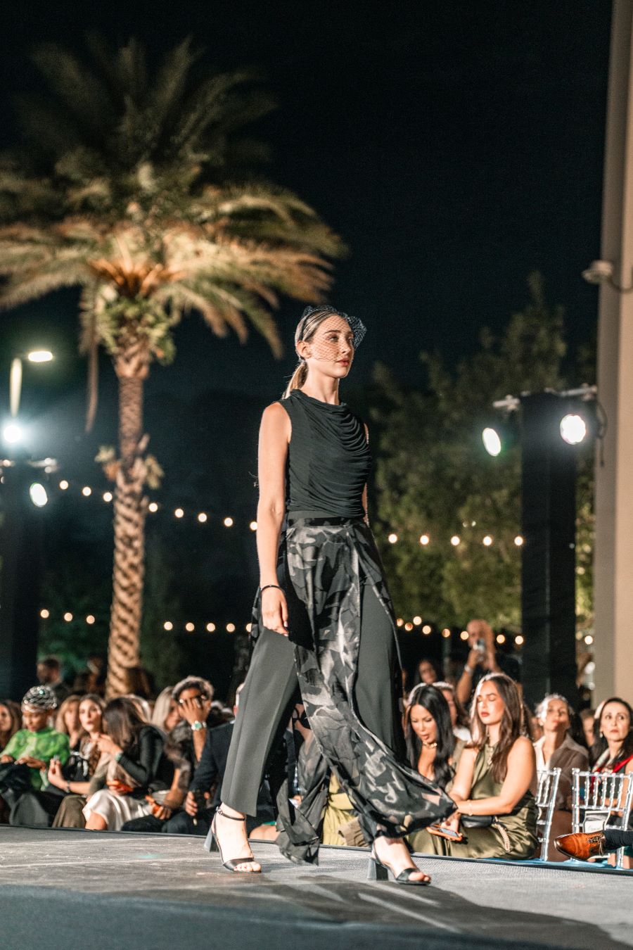 Models wearing Elie Tahari couture at Miami fashion event.