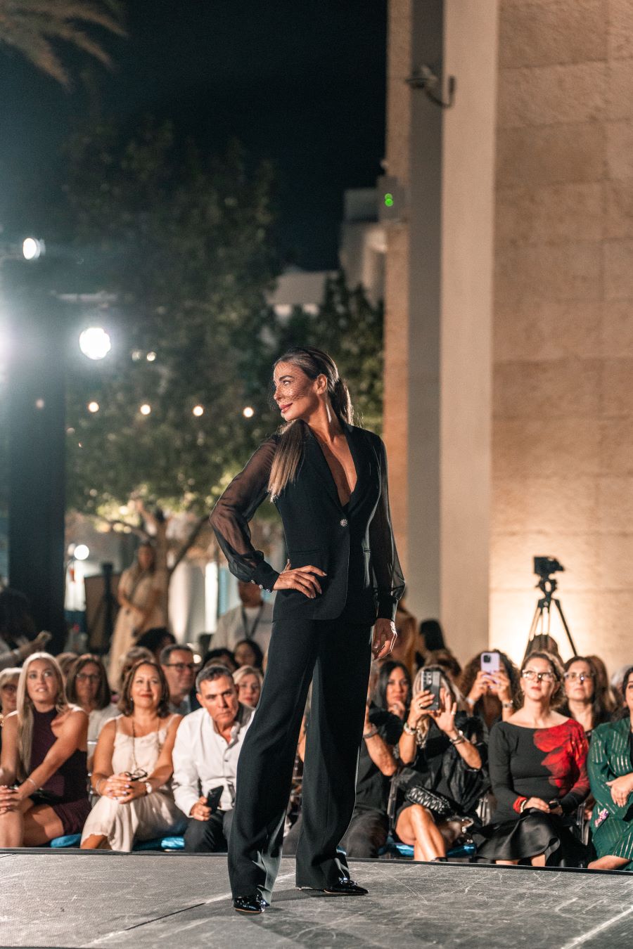 Models wearing Elie Tahari couture at Miami fashion event.