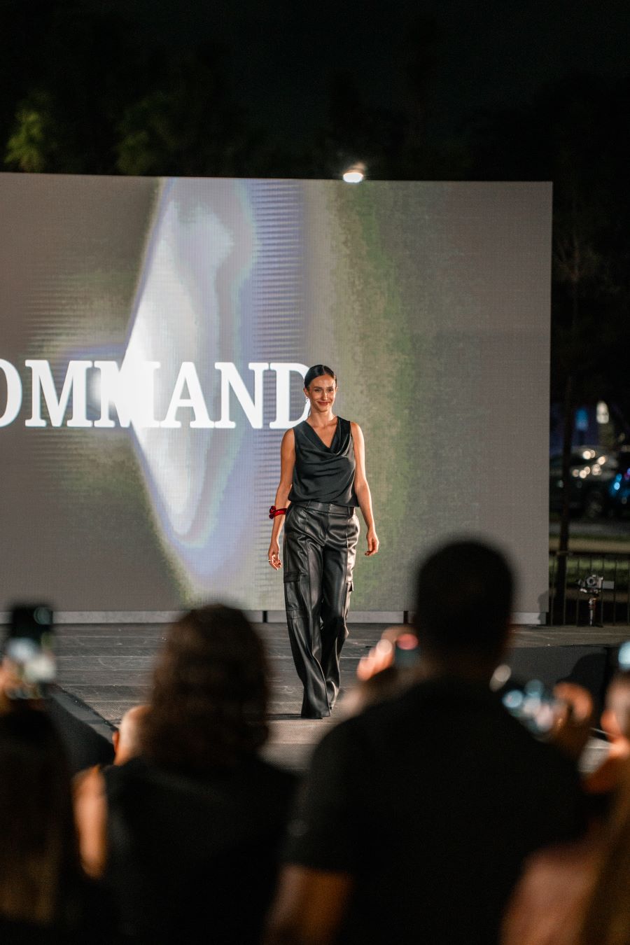 Models wearing Elie Tahari couture at Miami fashion event.