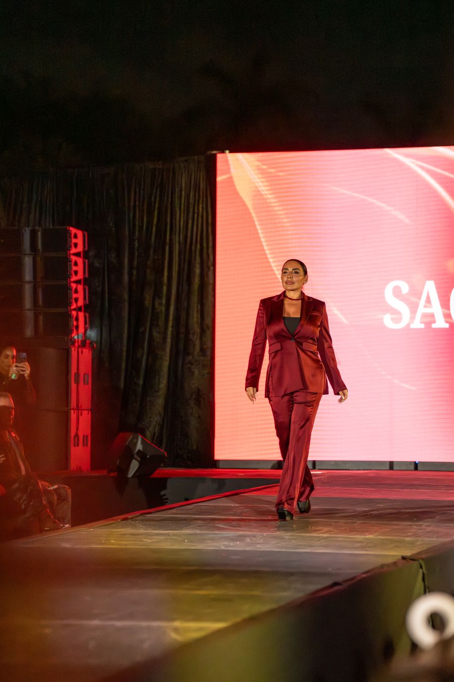 Models wearing Elie Tahari couture at Miami fashion event.